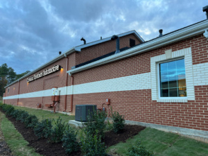 Freshly painted commercial building exterior protected from Apex, NC weather