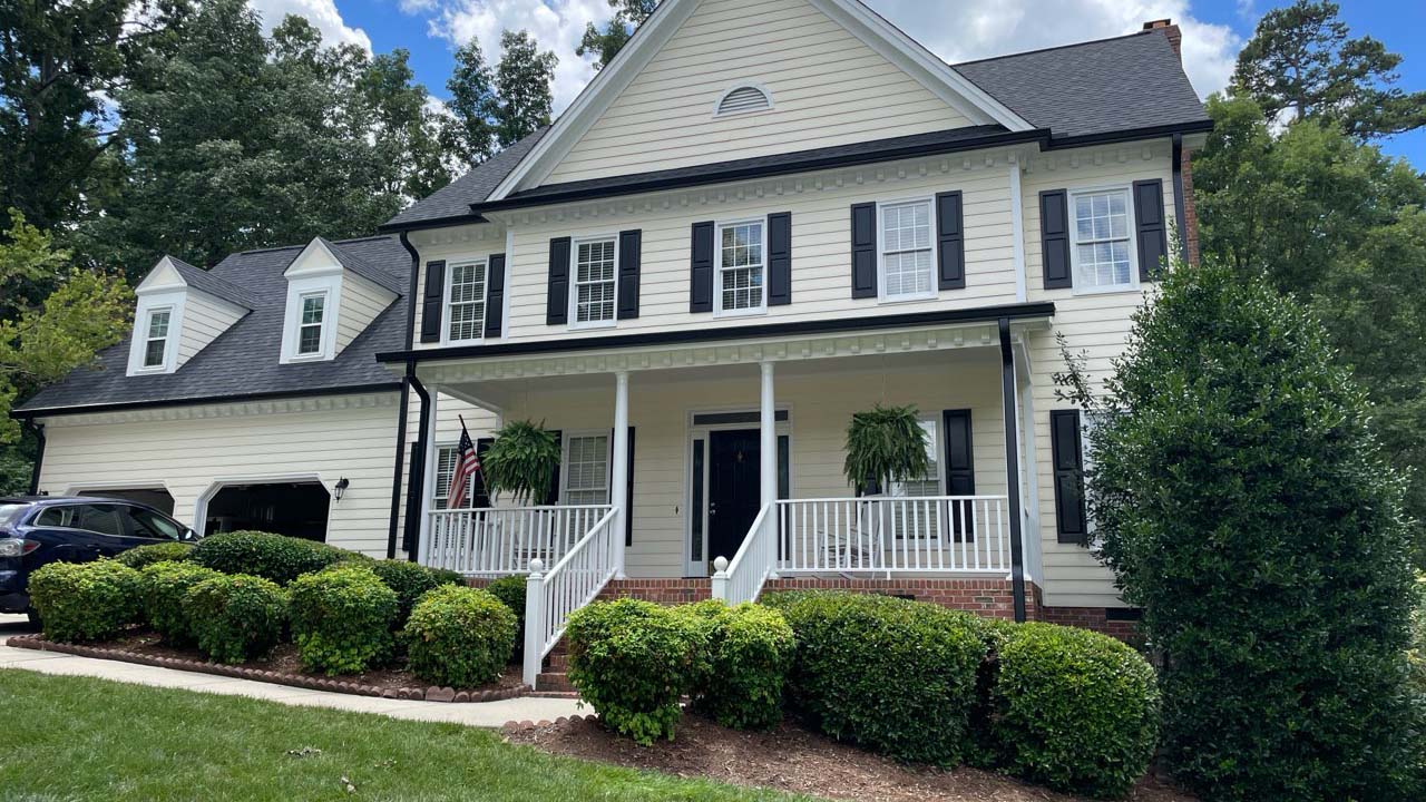 Street view of a residential exterior painting job in Raleigh North Carolina. 