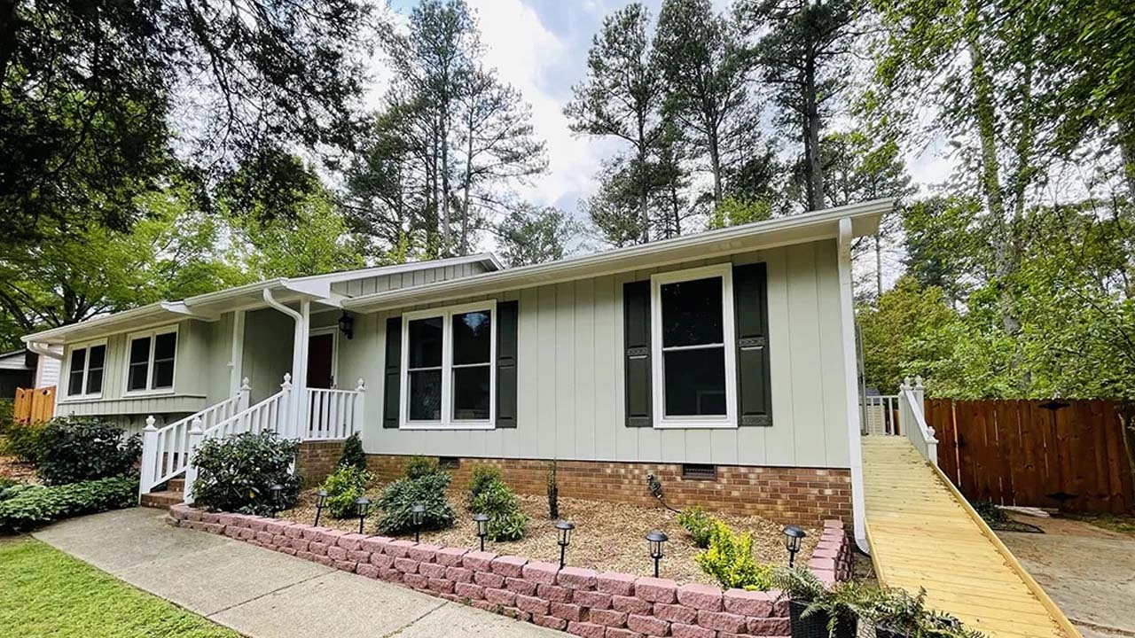 A house in Raleigh that is newly painted. The paint used is yellow making it more vibrant and beautiful.