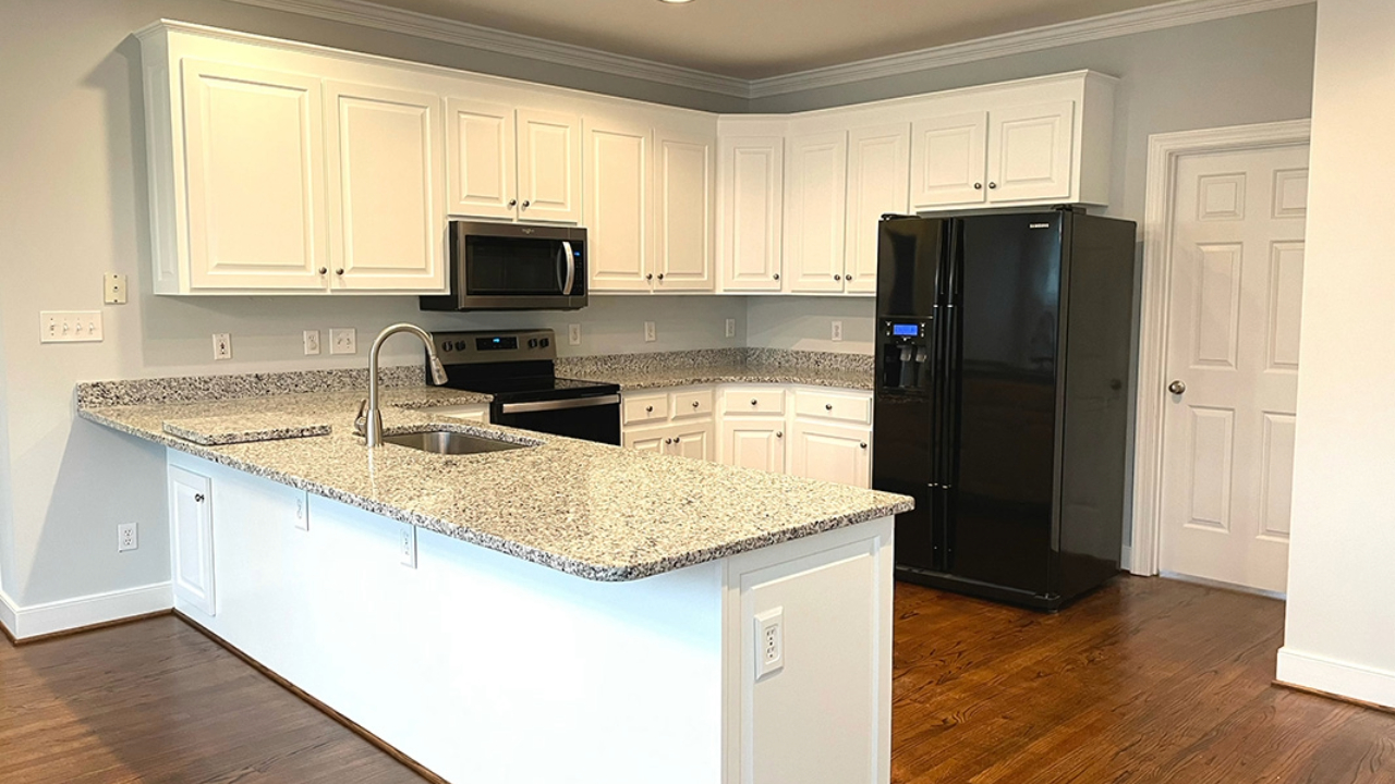 A vibrant kitchen because of its new white paint.