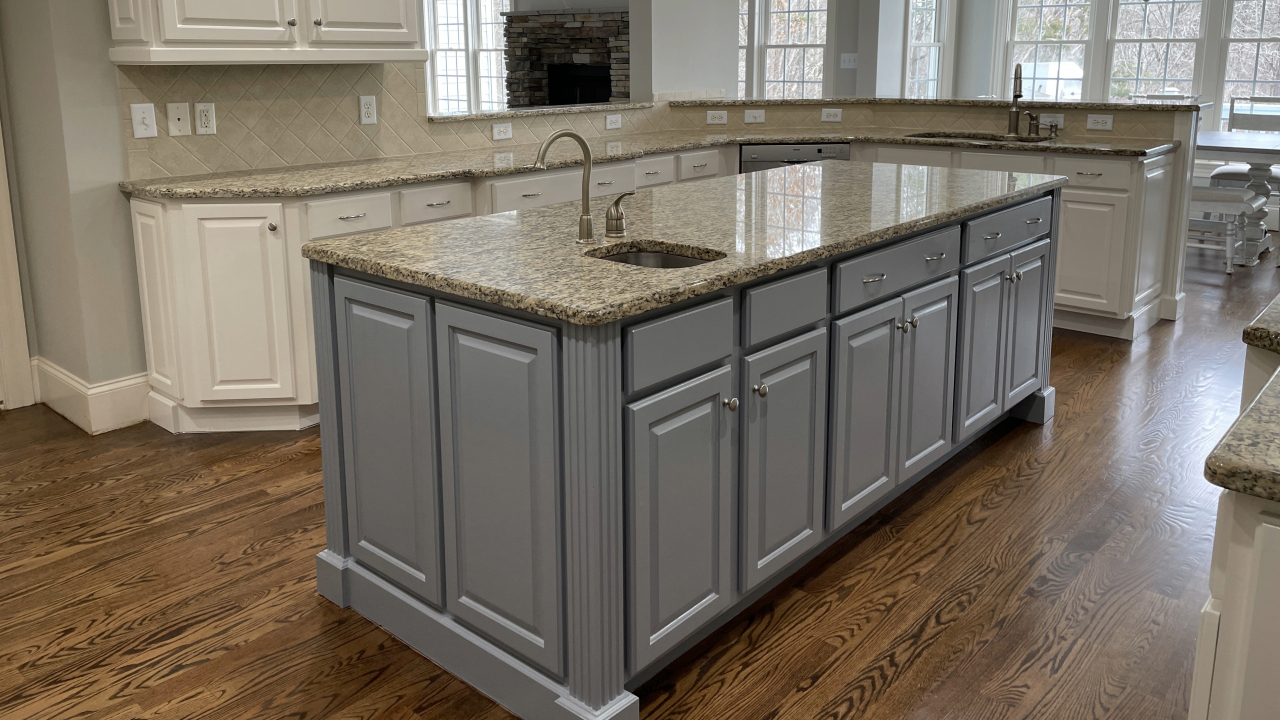 A kitchen cabinet painted in a classic gray undertone.