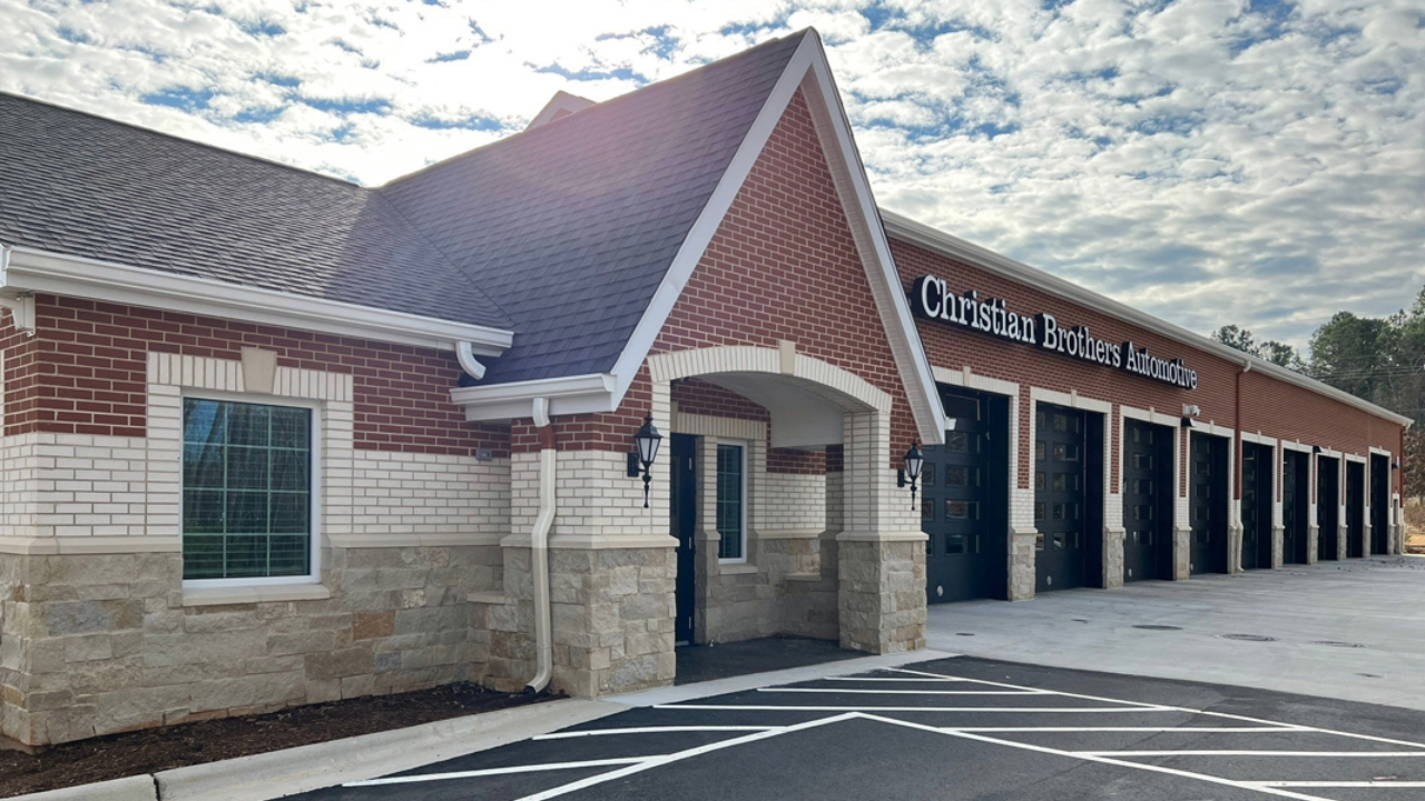 An exterior shot of a newly painted auto shop.