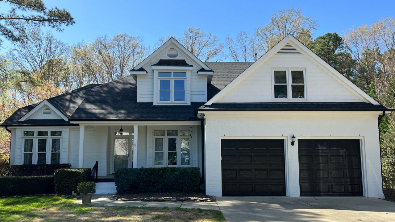 A newly painted home with white and black paint.