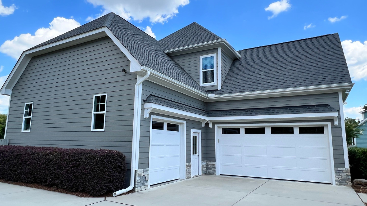 An image of the sleek, modern transformation of a freshly painted Raleigh home and its garage.