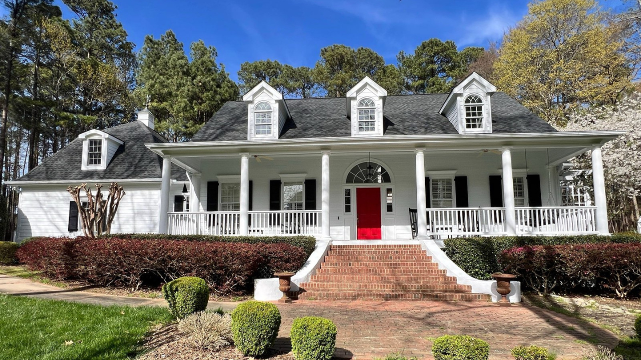 An image of a beautifully painted home in Raleigh, featuring a bold and stunning makeover that exceeded the homeowner's expectations.