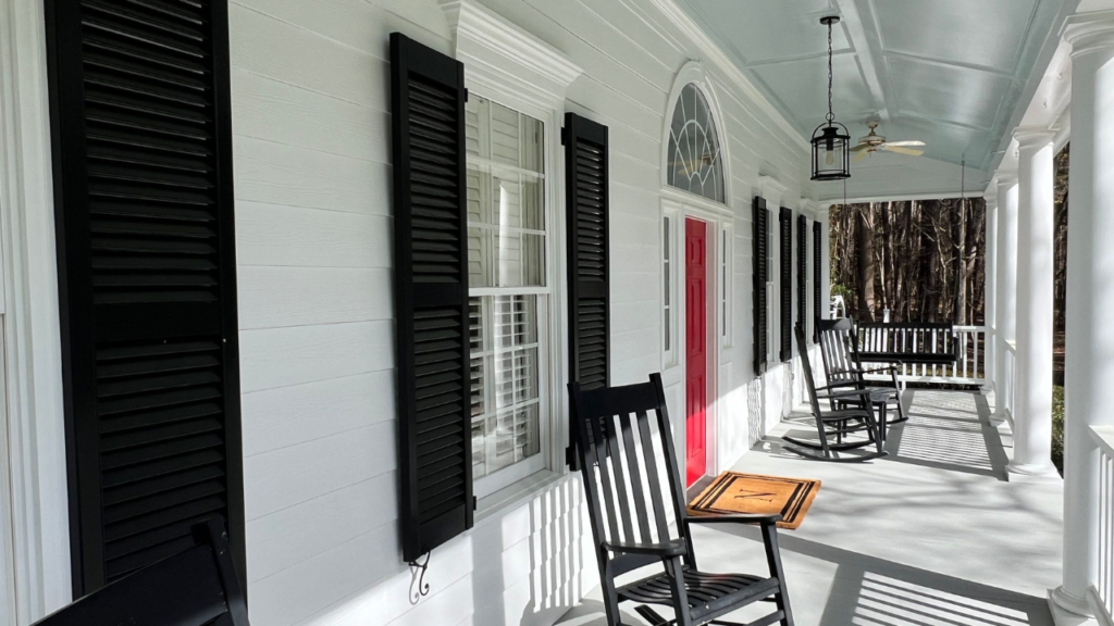 A stunning image showcasing the transformative exterior makeover of a home in Raleigh, highlighting why hiring professional painters is a smart investment.