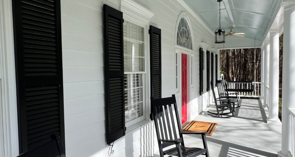 A stunning image showcasing the transformative exterior makeover of a home in Raleigh, highlighting why hiring professional painters is a smart investment.