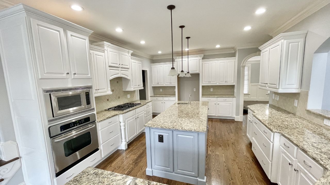 A new and fresh look kitchen area with white paint.