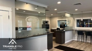 Homeowner painting an interior room with low VOC paint in Raleigh