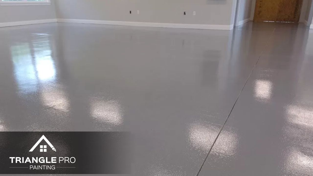 This is a polished epoxy floor painting project by Triangle Pro Painting in Umstead Raleigh, NC.