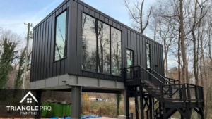This is a modern commercial building exterior painted black by Triangle Pro Painting in Umstead Raleigh, NC.