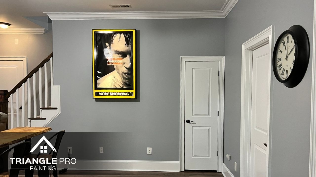A room painted in soft gray with bright white trim for a sleek, finished feel.