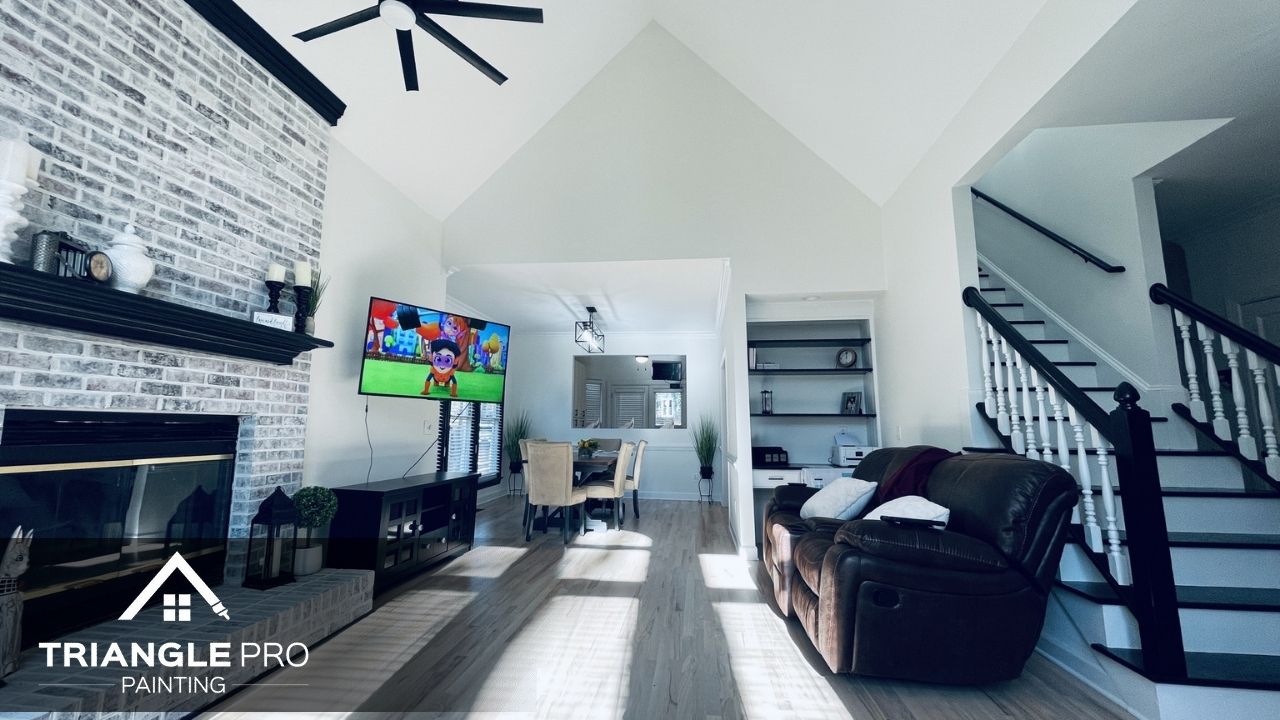 A bright and spacious living room with crisp white walls and detailed trim work.