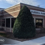 An image of an exterior of a dental clinic in Raleigh, Nc that is painted with red paint.