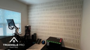 A wall painted with white paint in Raleigh, NC.