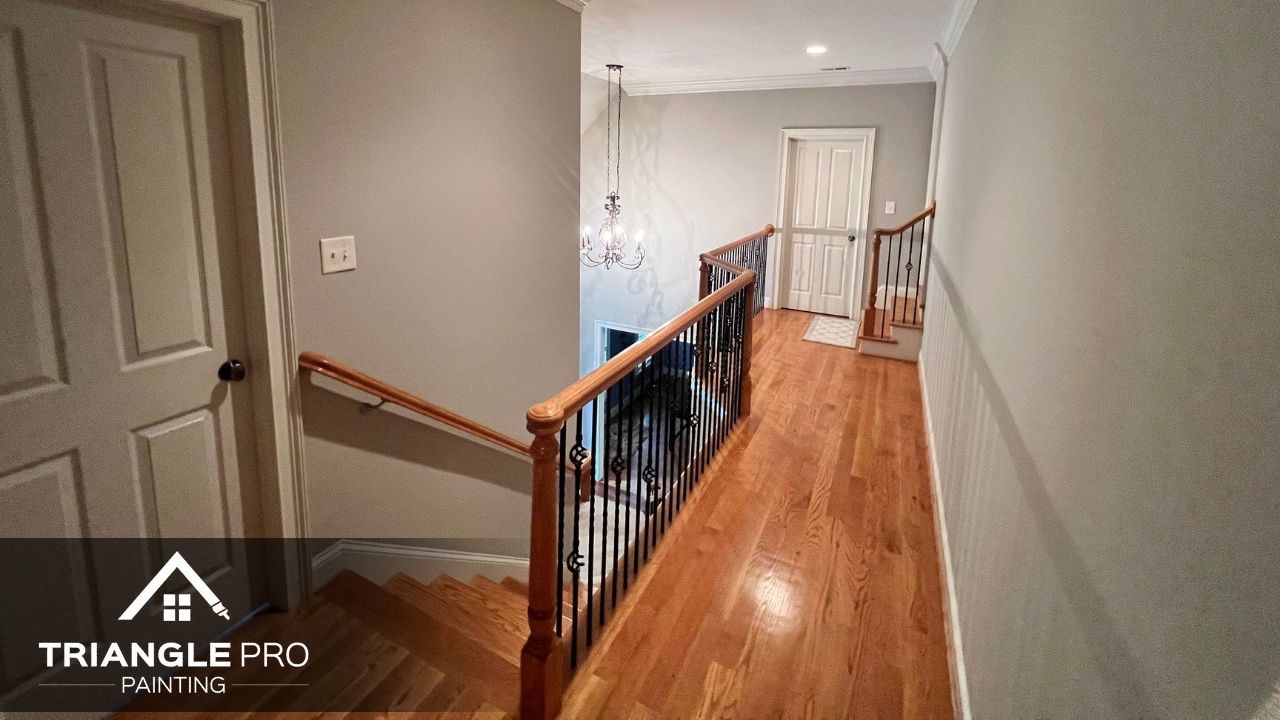 Hallway painted in soft gray with white trim.