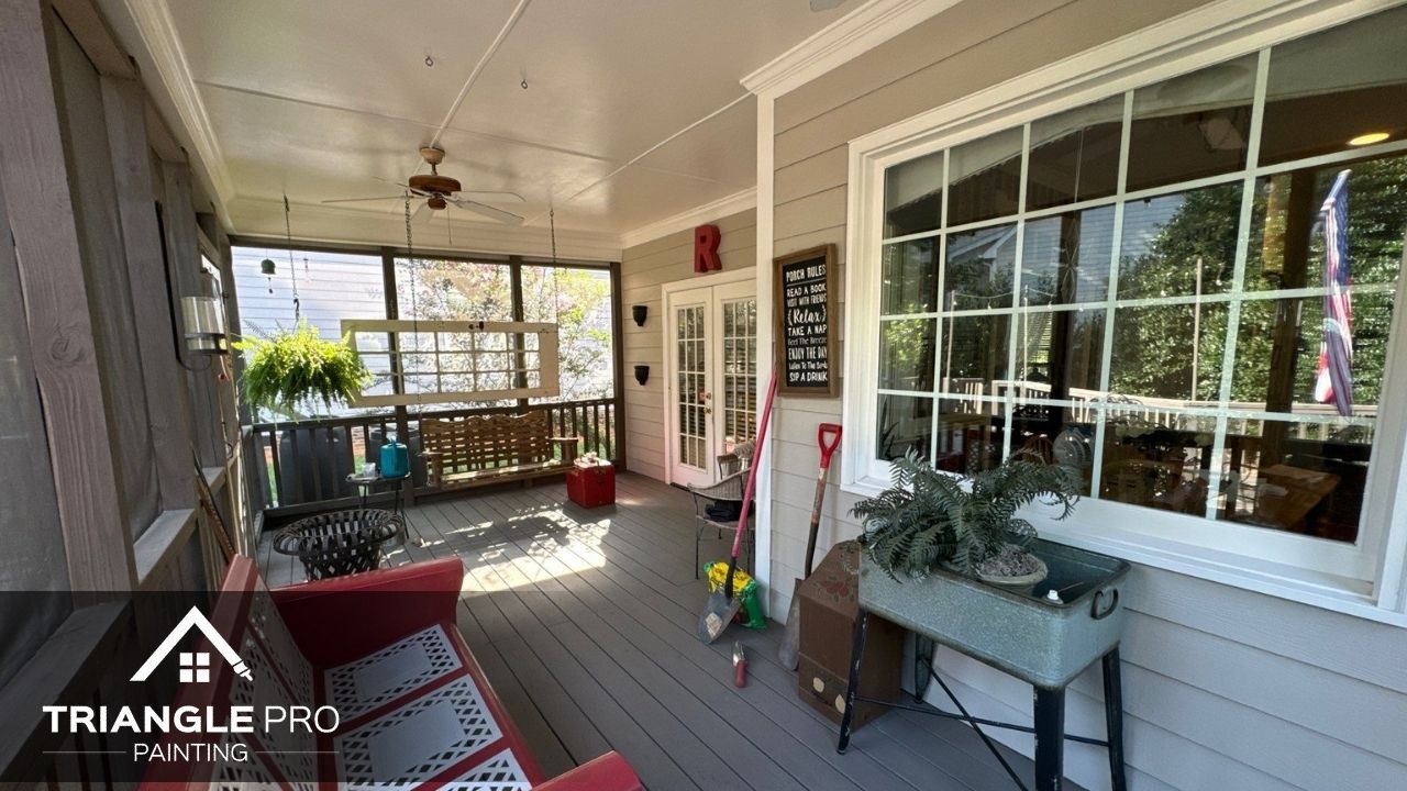 This photo captures a painted covered porch area with neutral tones and clean white trim by Triangle Pro Painting in Madonna Acres Raleigh NC.