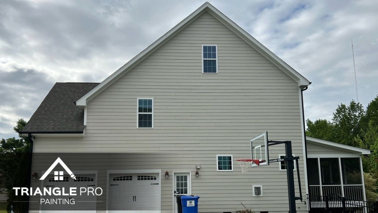 An exterior of a house that is painted with cream colored paint.
