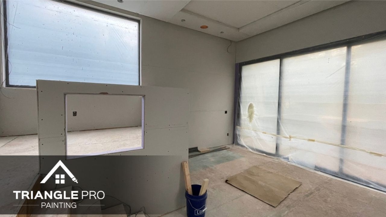 A commercial building that is undergoing a painting and renovation.