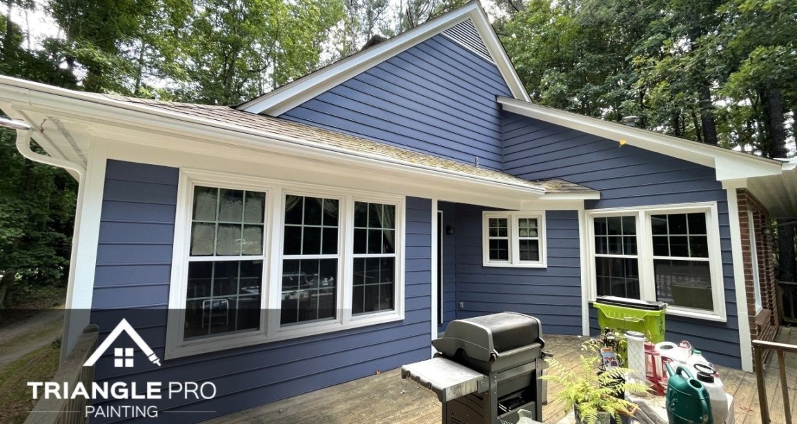 A house in Raleigh, Nc that is painted with blue ppint.
