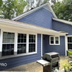 A house in Raleigh, Nc that is painted with blue ppint.
