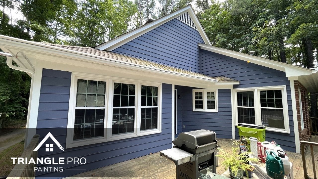 A house in Raleigh, Nc that is painted with blue ppint.