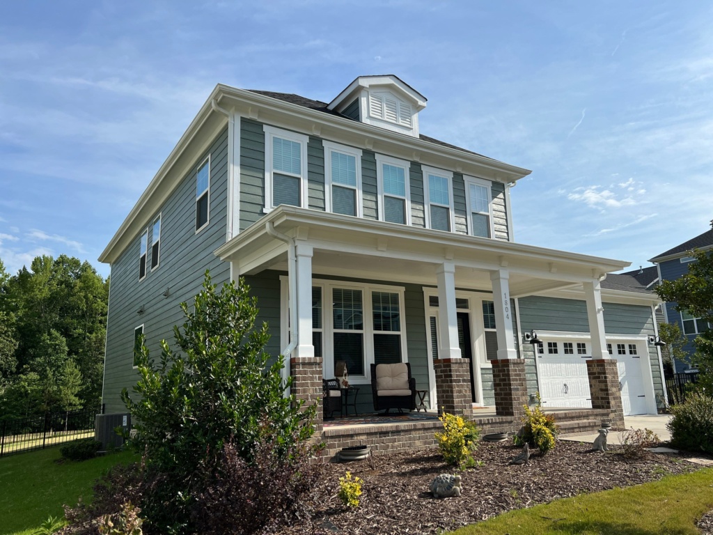 Expert siding painting services in Fuquay-Varina, NC protecting homes from weather damage