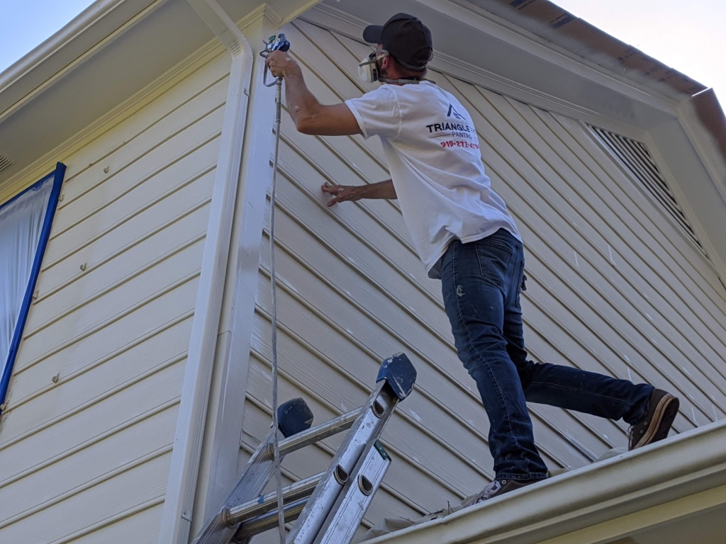 Professional siding painting in Raleigh, NC enhancing residential curb appeal