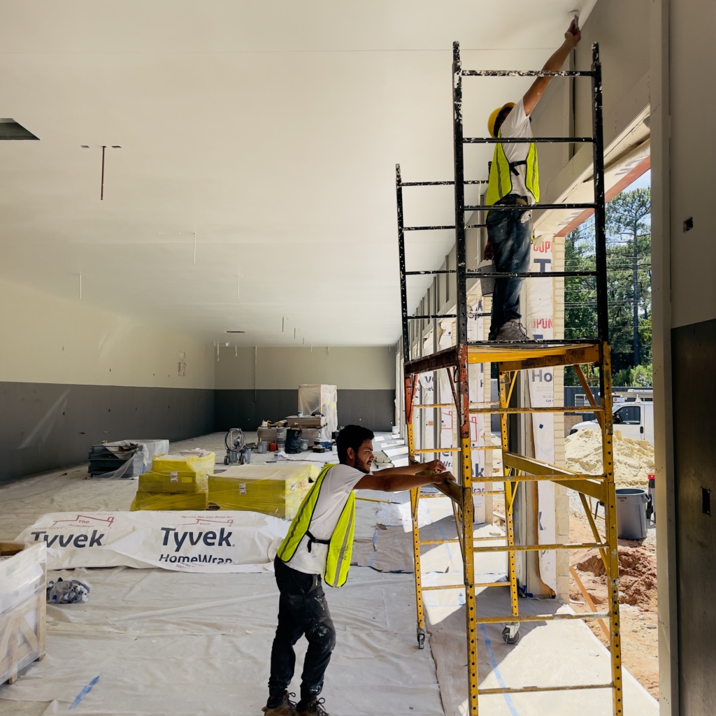 Professional commercial painter in Fuquay-Varina, NC enhancing offices and business properties