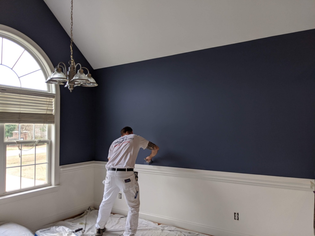 Professional residential painter in Chapel Hill, NC refreshing interior walls with clean, refined finishes