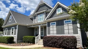 Peeling exterior paint on a Raleigh home showing it’s time to repaint