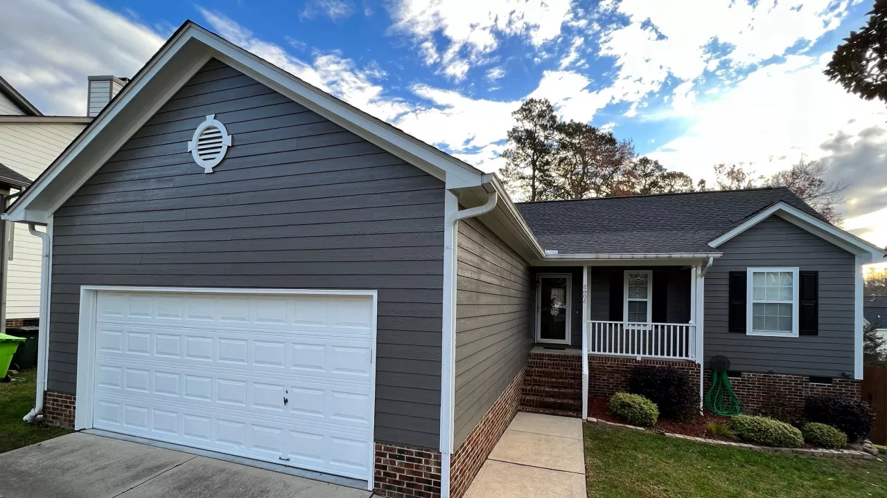A newly painted garage, the color of the paint used is gray color.