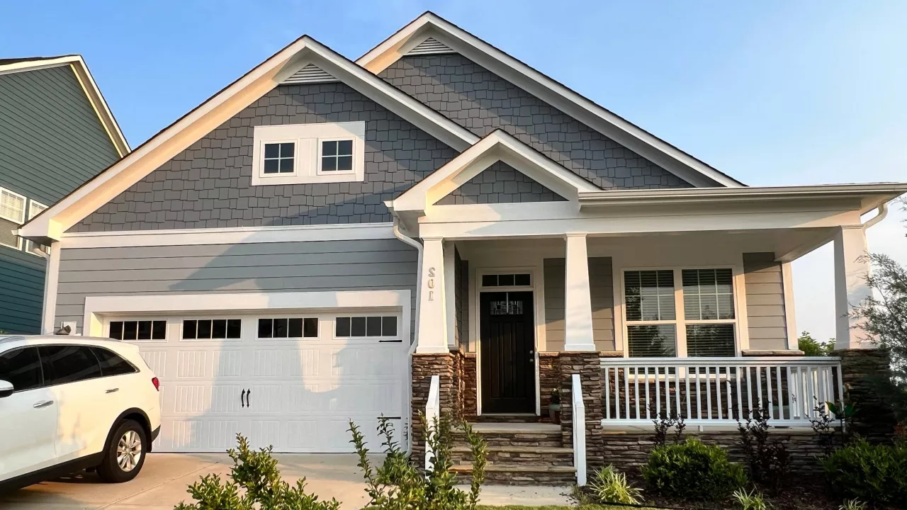 A beautiful house in Raleigh, NC that has a newly painted garage.