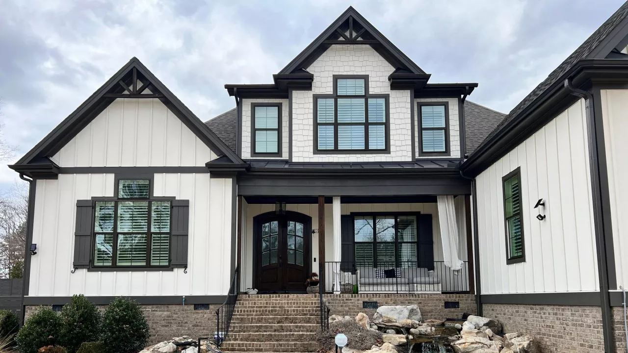 An image of a exterior house with brown paint in Raleigh, NC.
