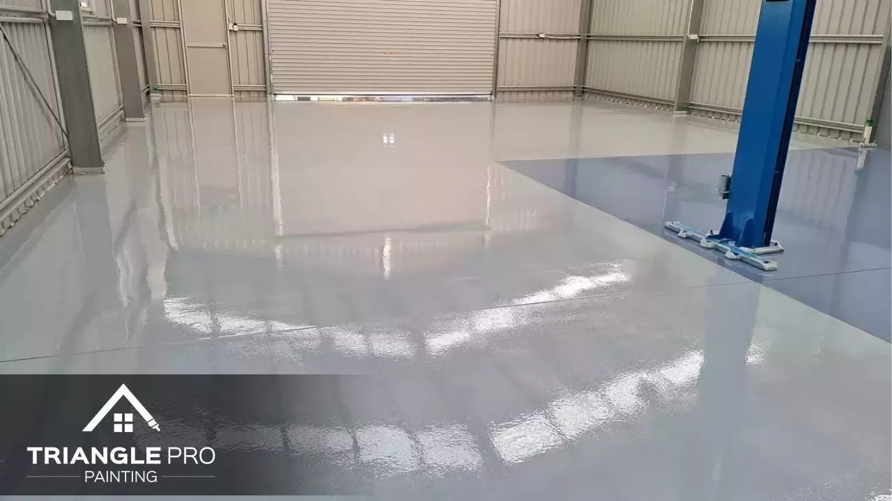 This is a commercial floor coating with glossy epoxy finish in a warehouse by Triangle Pro Painting in Wayland Heights Raleigh.