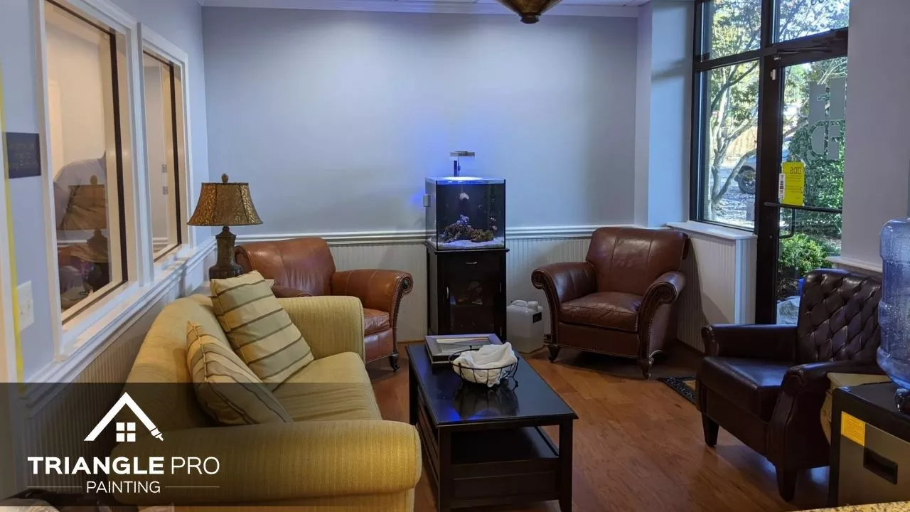 This is a cozy office lounge area painted with a soft blue tone by Triangle Pro Painting in Umstead Raleigh, NC.