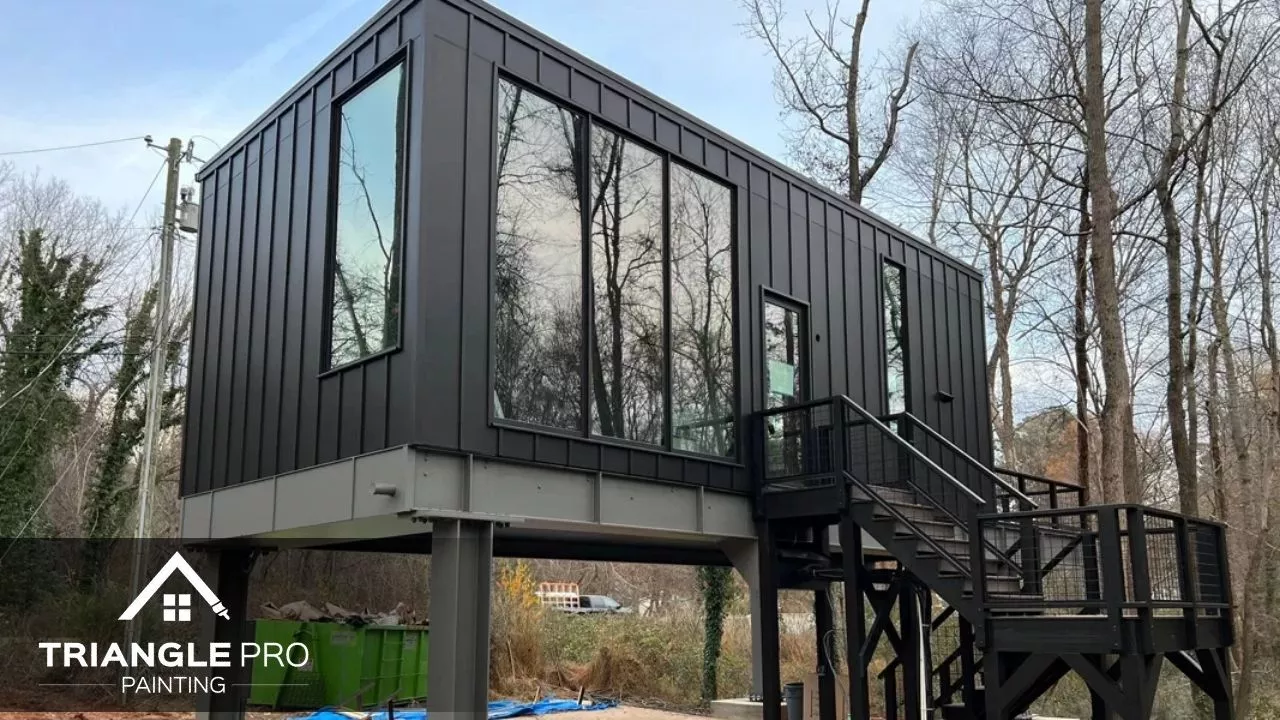 This is a modern commercial building exterior painted black by Triangle Pro Painting in Umstead Raleigh, NC.