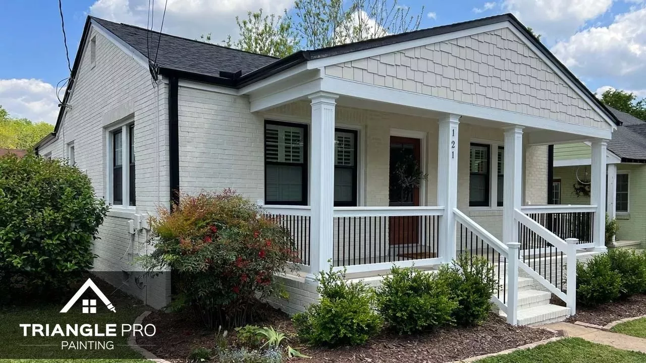 This is a painted white brick home exterior by Triangle Pro Painting in Wayland Heights Raleigh, NC.