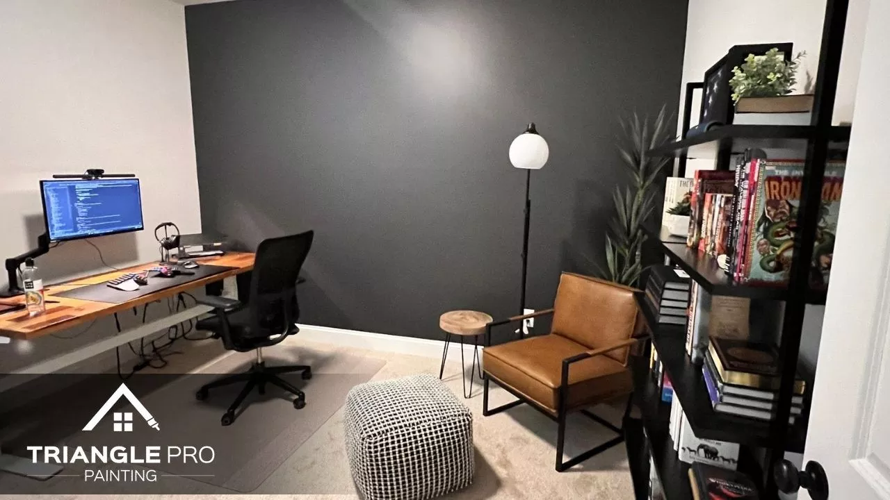 This is an office interior with a dark accent wall by Triangle Pro Painting in Umstead Raleigh.