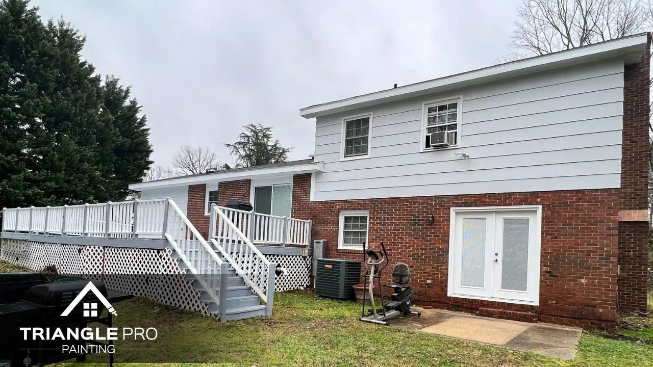 This is a full view of a home’s exterior with updated paint in Umstead Raleigh by Triangle Pro Painting.