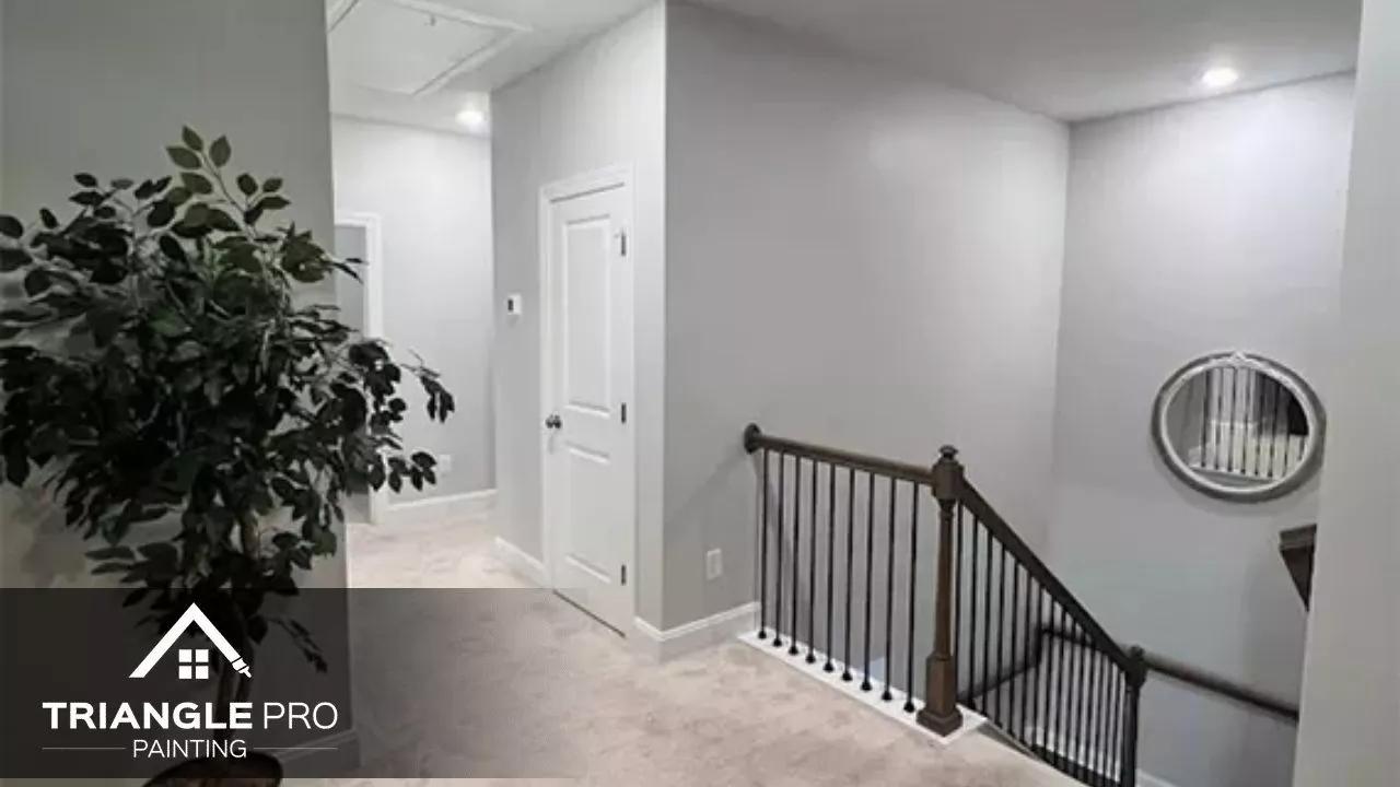 This is a hallway with clean white and gray tones painted by Triangle Pro Painting in Umstead Raleigh, NC.