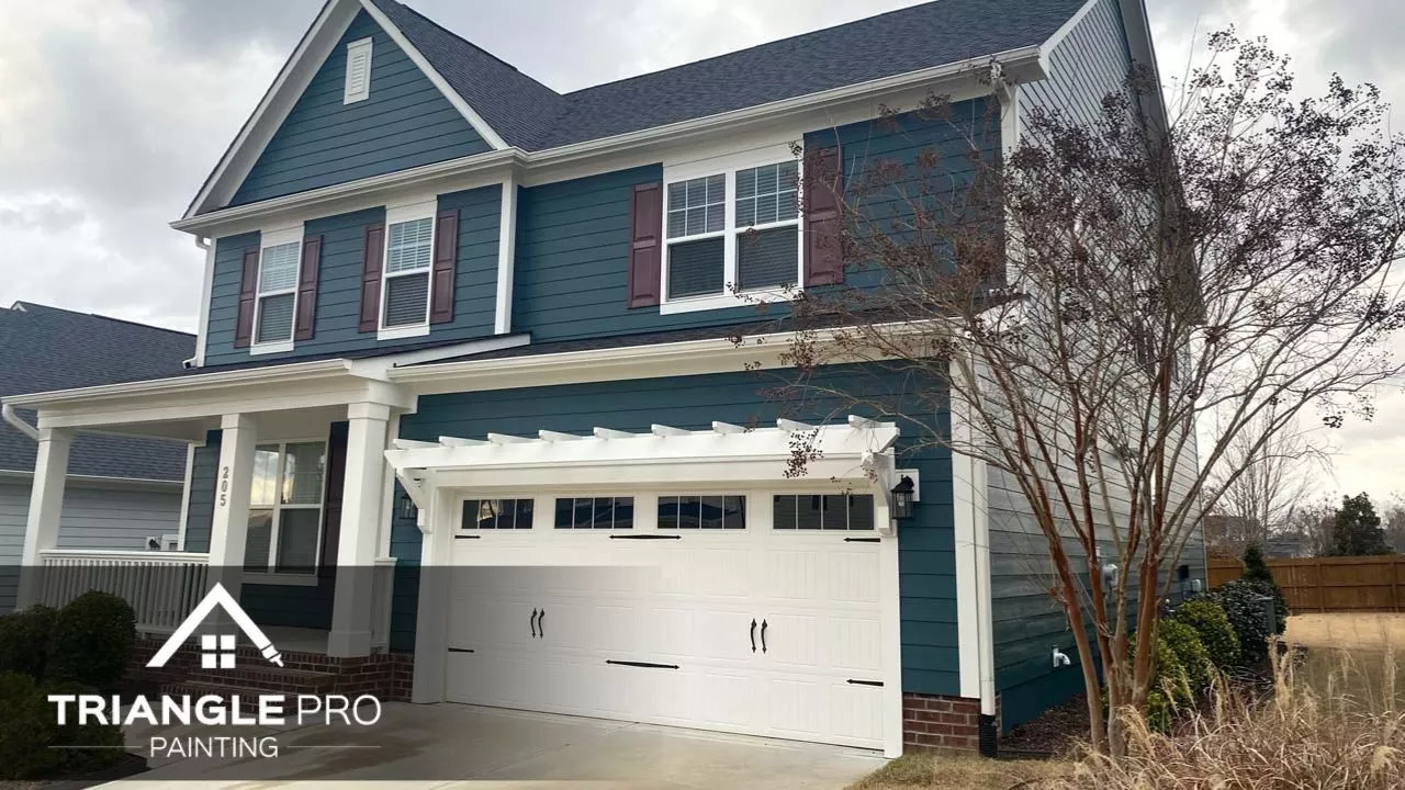 An exterior of a house in Raleigh, Nc that is painted with blue paint.