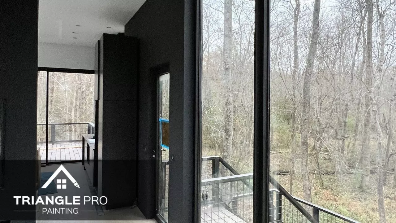 A black painted wall in a commercial space in Raleigh, NC.