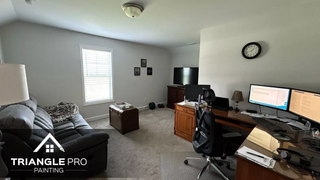 A wall of a house that is painted with white paint.