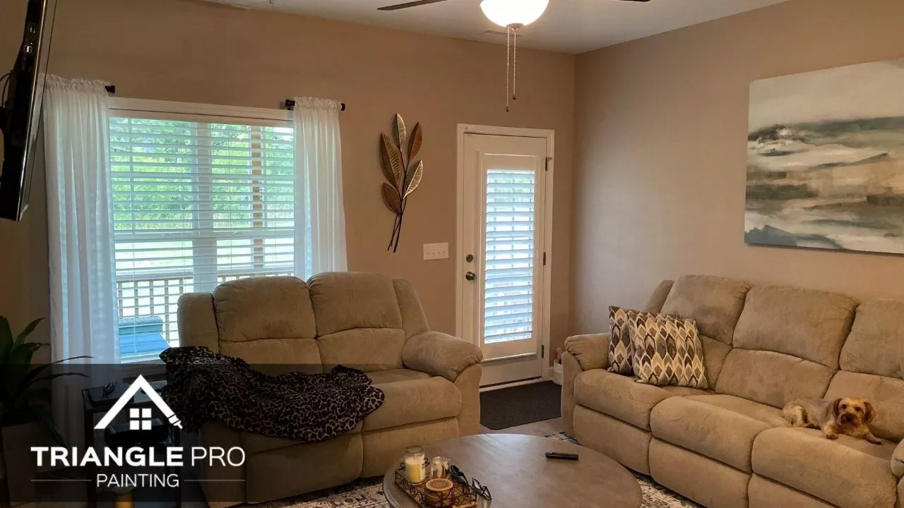 An interior of a hpuse that has a cream painted wall.