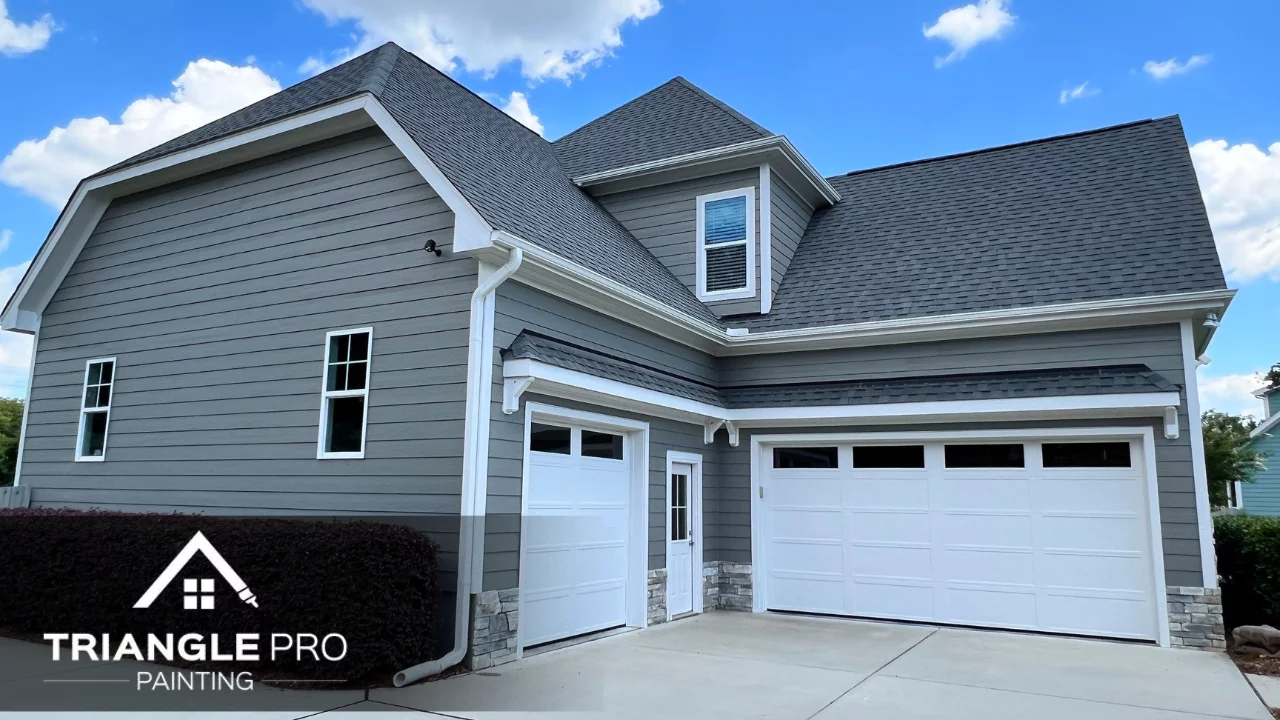 An image of an exterior of a house painted with gray paint.