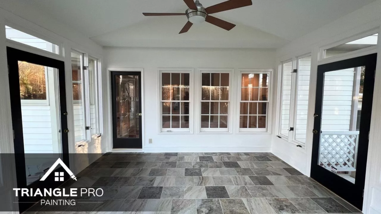 This is an image of a door and walls that is painted with white paint in Raleigh.