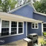 A house in Raleigh, Nc that is painted with blue ppint.