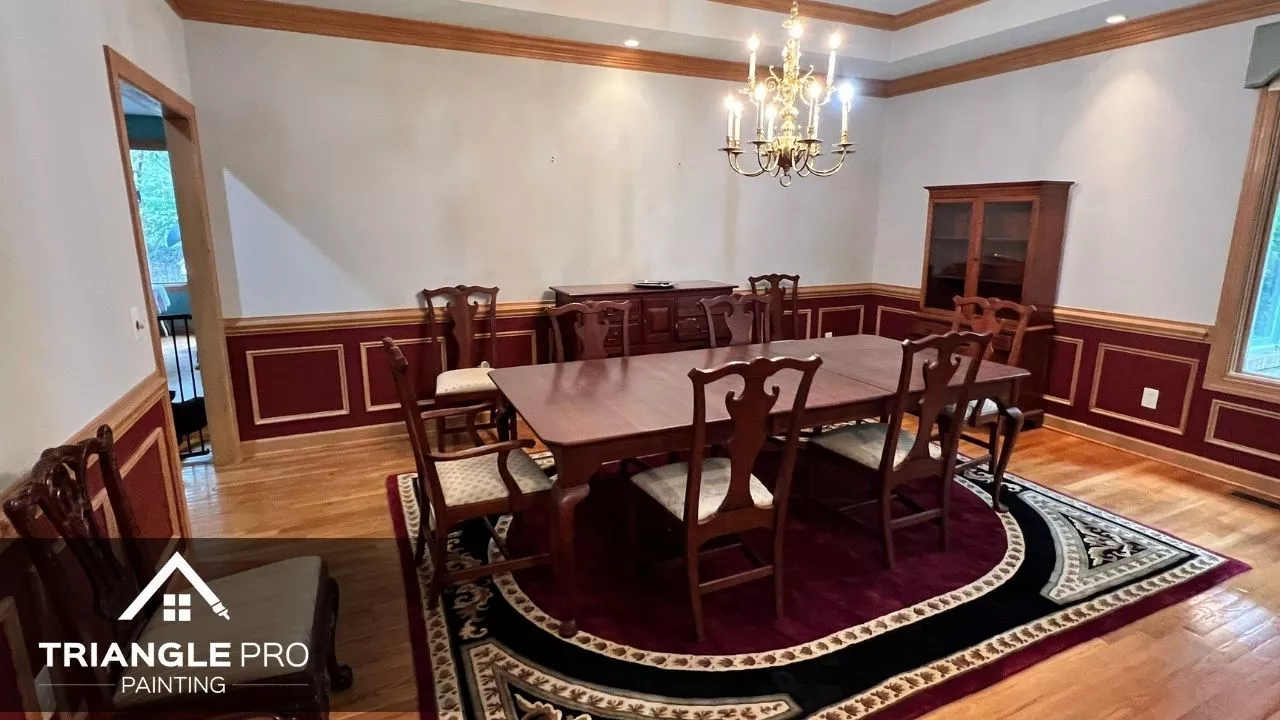This is a freshly painted formal dining room with crown molding and wainscoting by Triangle Pro Painting in Boylan Heights Raleigh, NC.