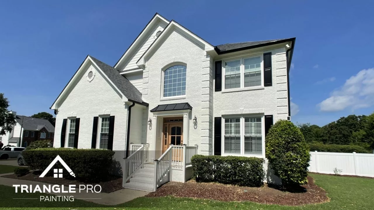 This is an image of a beautiful house in Raleigh, NC that is painted with white paint.